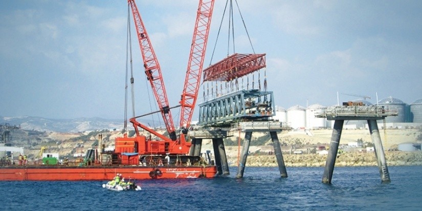 Marteam - Construction of Jetty:Transportation with barges: 47 Trestles, 12 units of Platform & 14 Loading Arms. Lifting & Installing the Trestles onto the circular pile foundations & concrete racks